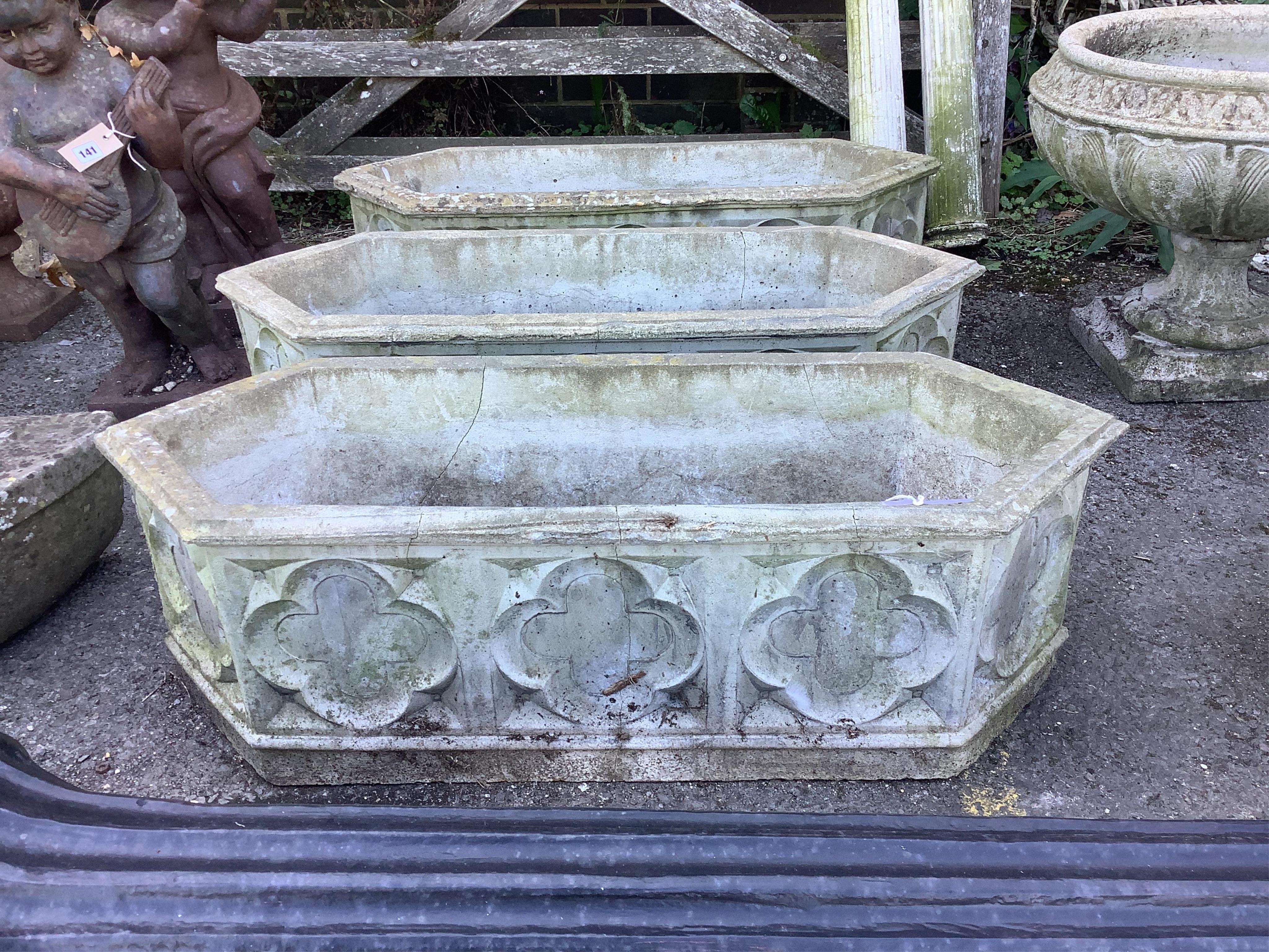 A set of three reconstituted stone hexagonal garden planters, width 89cm, depth 32cm, height 28cm. Condition - poor to fair